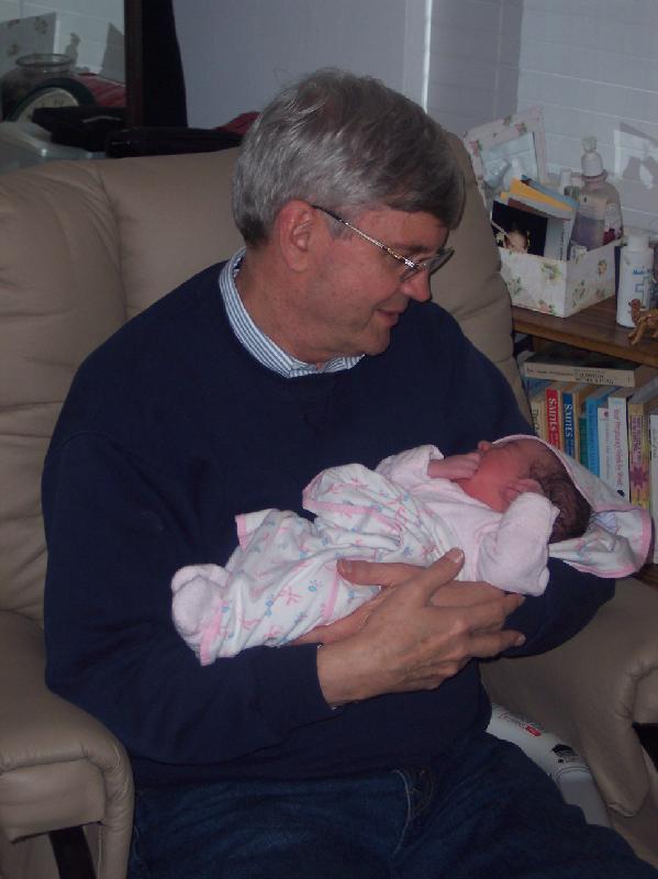 Dad holding grandaughter 2005